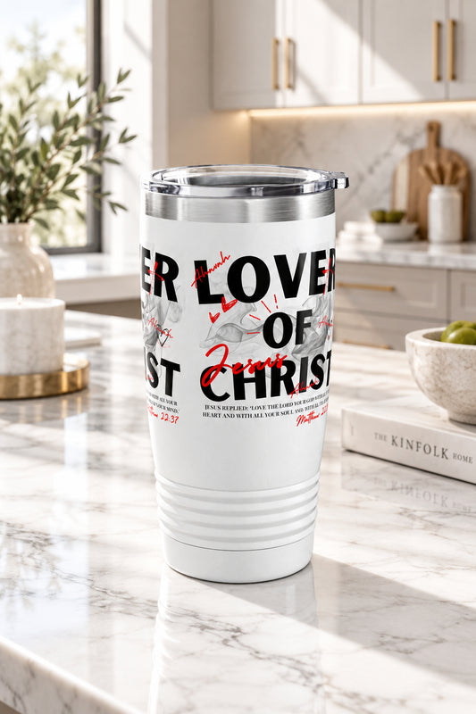 A white insulated travel tumbler with a clear lid, featuring a graphic print with the text 'LOVER OF CHRIST' in black and red script with gray illustrations, shown on a plain white background.