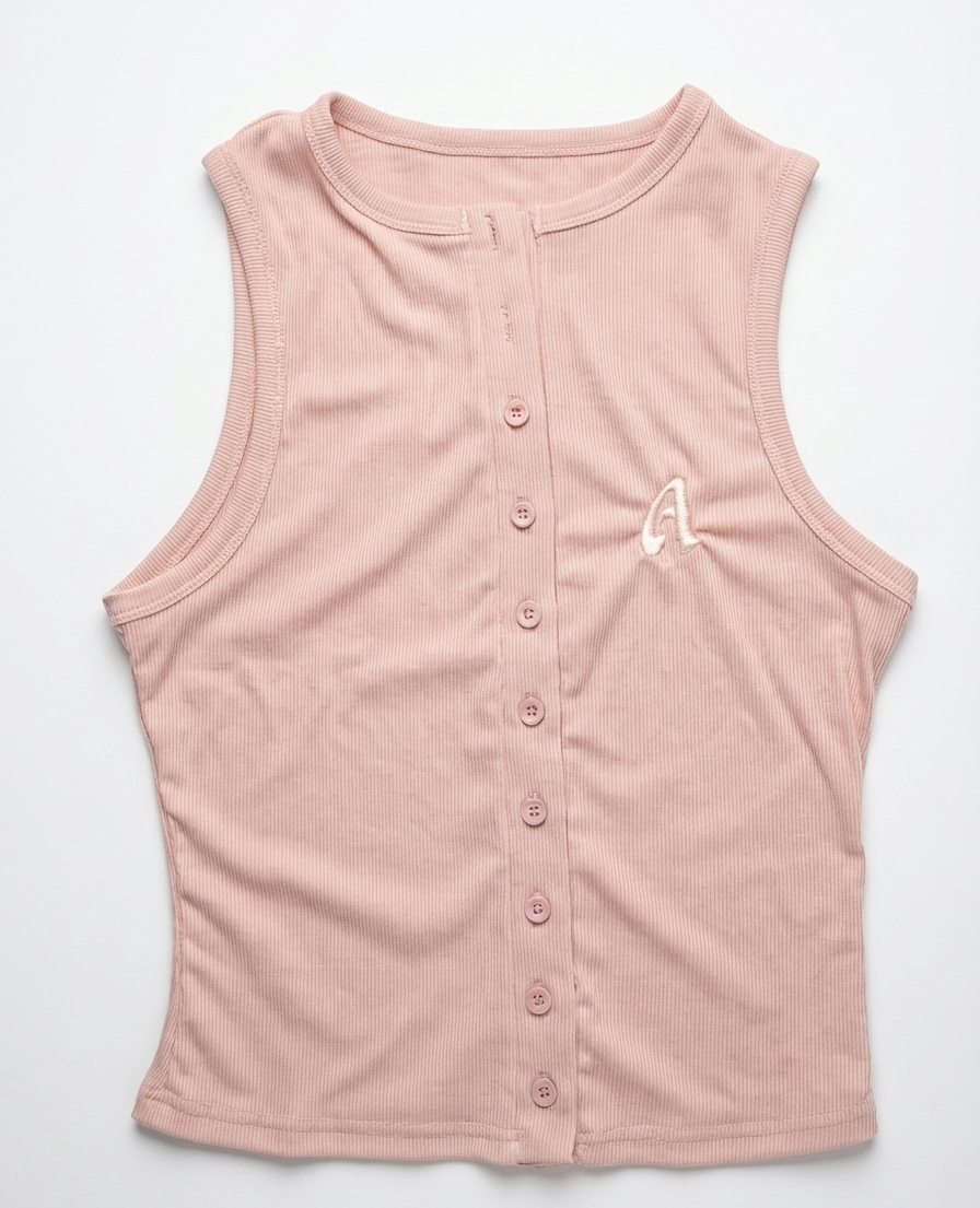 Pink sleeveless button-up shirt with a white letter 'A' on a light gray background