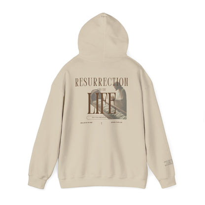 Beige hoodie with text and graphic design on a white background