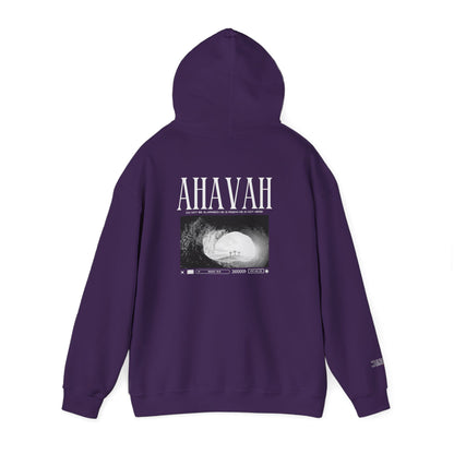 A purple pullover hoodie shown from the back, featuring a white graphic print with the word 'AHAVAH' and a black-and-white photograph of a cave interior. The hoodie is displayed on a clean white background.