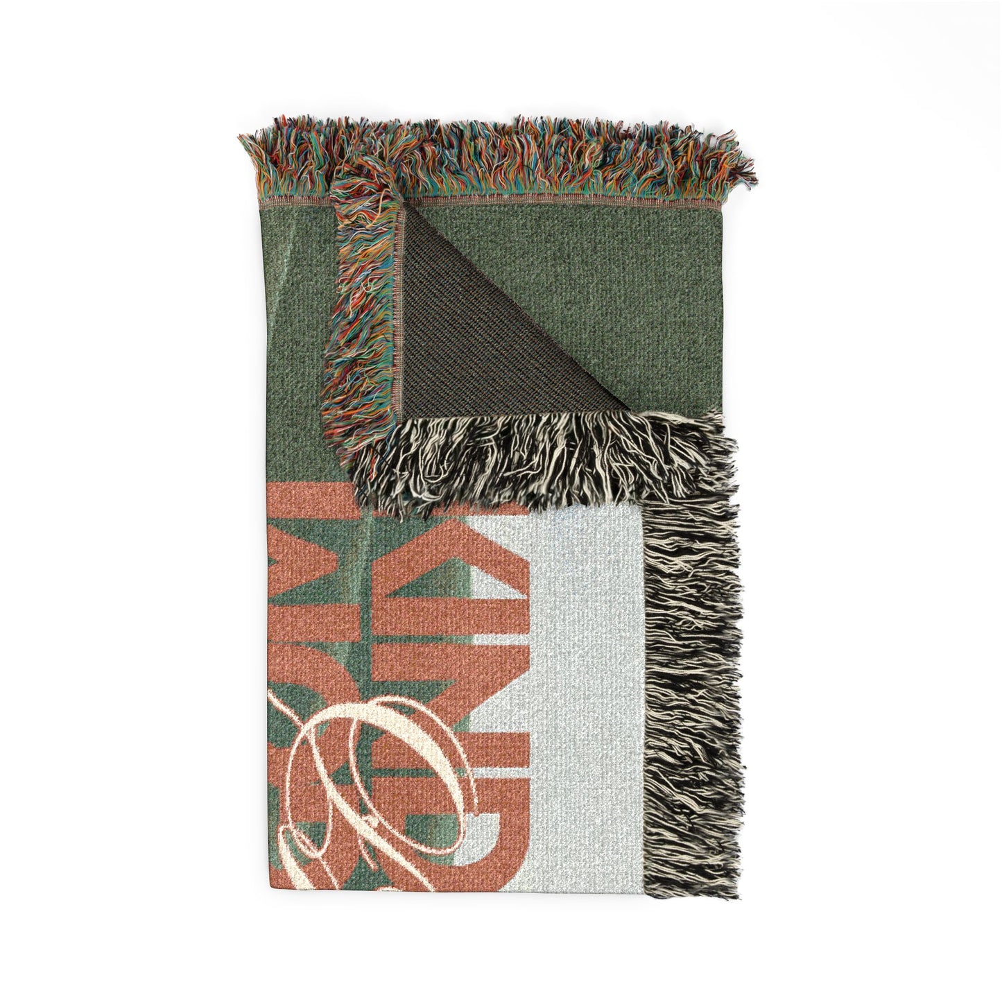 Green blanket with fringe on a white background