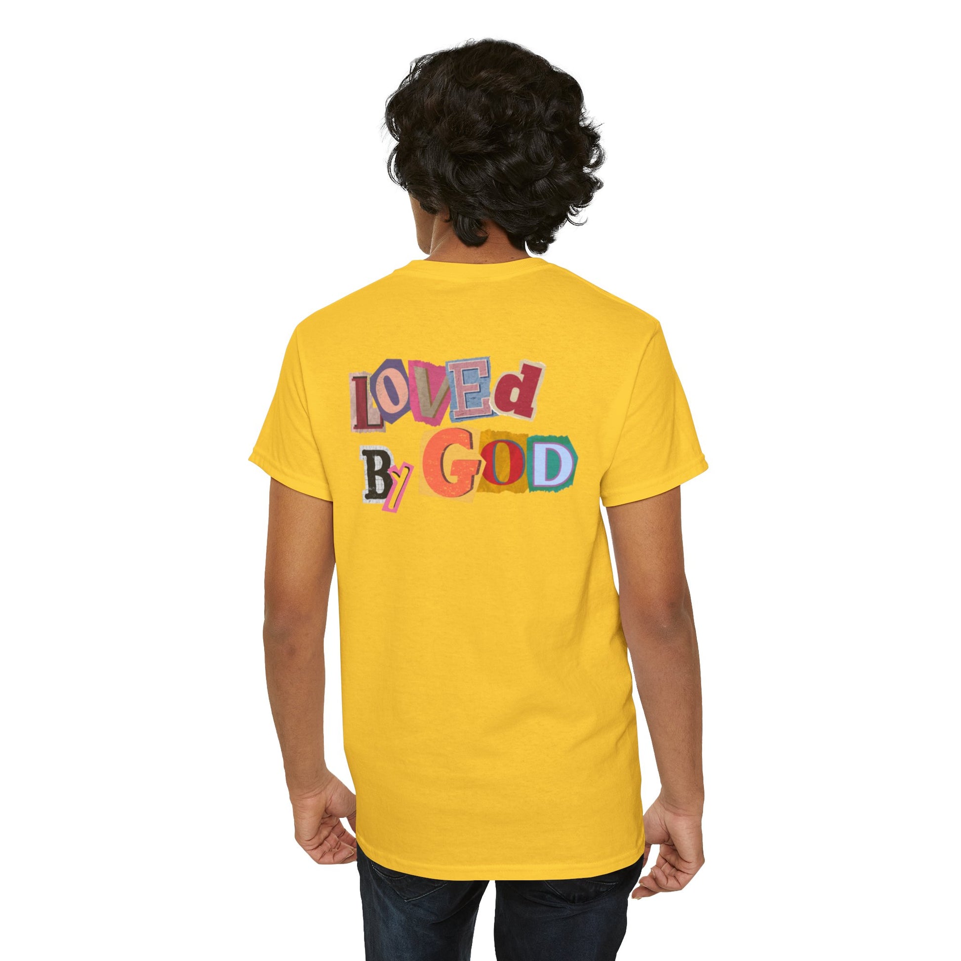 Person wearing a yellow t-shirt with 'LOVED BY GOD' text on the back, standing against a white background.